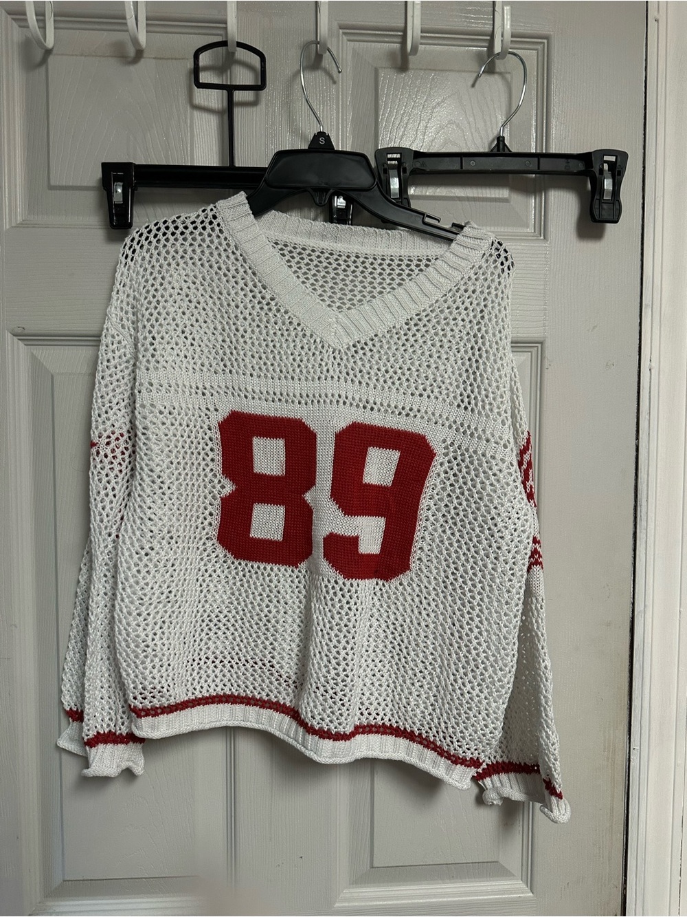 Amazon Women's White Open-Knit V-Neck Sweater with Red '89 Detail